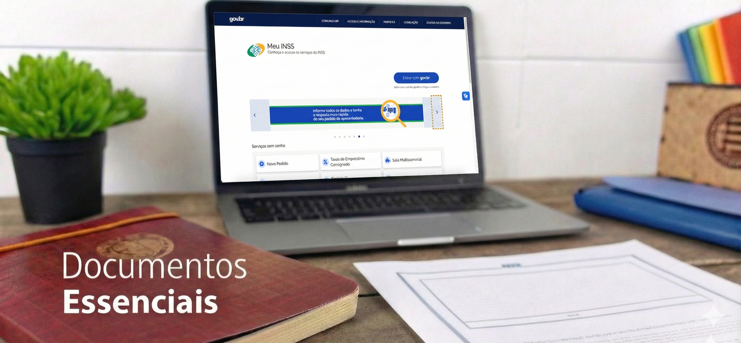 Escritório com notebook mostrando 'MEU INSS', livro 'Documentos Essenciais' e papéis, representando planejamento previdenciário.
